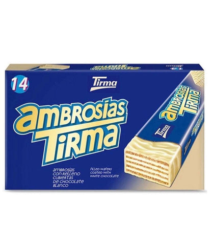 Deliciosas ambrosías de chocolate blanco Tirma, tradicionales de Canarias, en caja con 14 unidades, ideal para disfrutar.